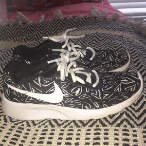 Nike black athletic shoes/white heart outlines